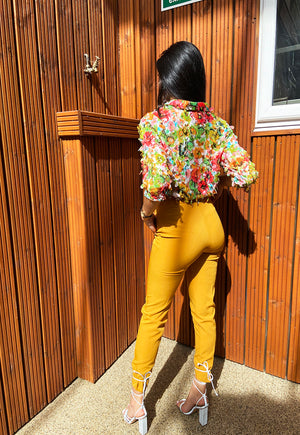 Back view of Shollyjaay's multicolour print shirt in orange