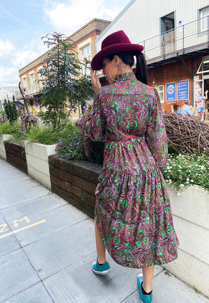 Back view of Shollyjaay's Paisley print midi dress in green and red