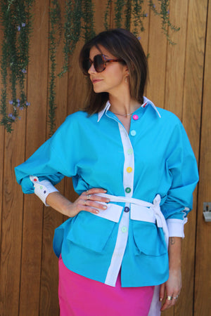 bright blue loose fit shirt with multi-coloured buttons